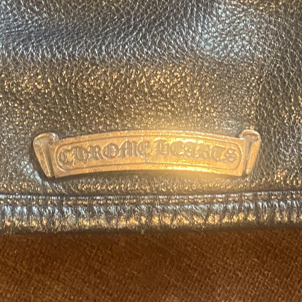 Chrome Hearts computer/shoulder bag.